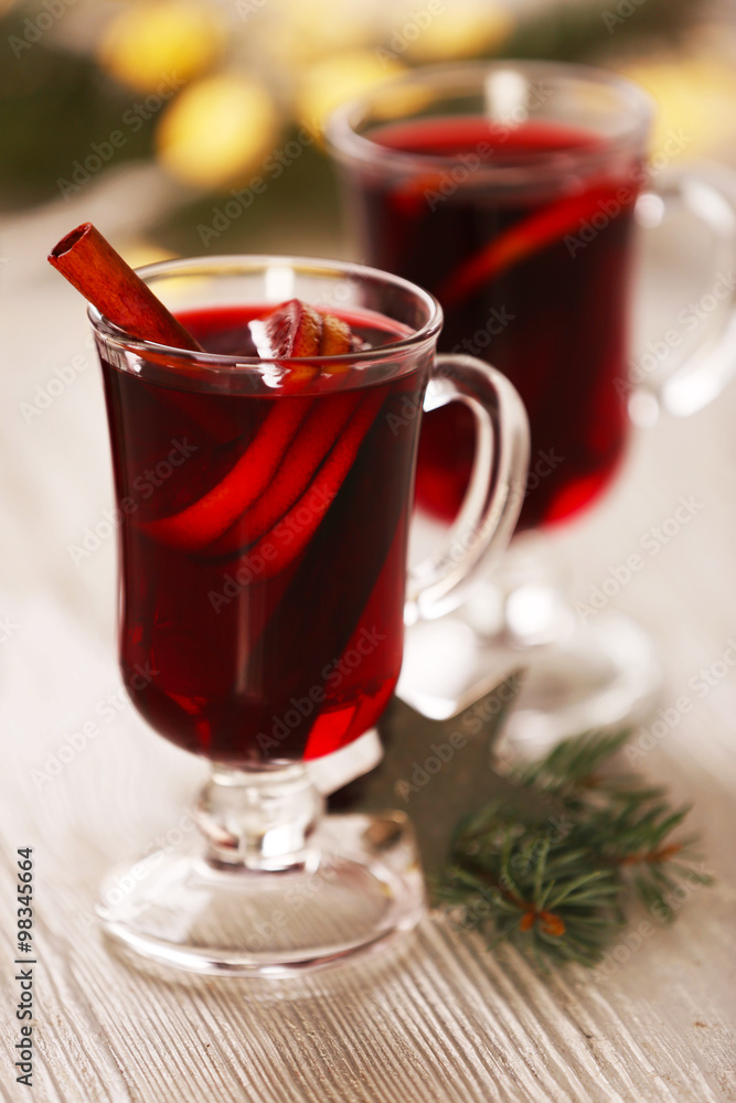 Mulled wine on wooden table, close-up Mulled wine on wooden table, close-up