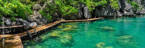 Very Clean and Clear lagoon lake Water next to a wooden path
