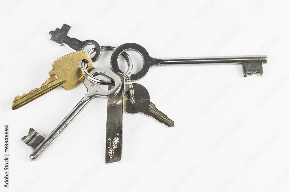 Six metal keys of different shape on white background Six metal keys of different shape on white background
