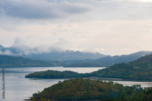 Big green Islands with fog and mist at the coast of Coron