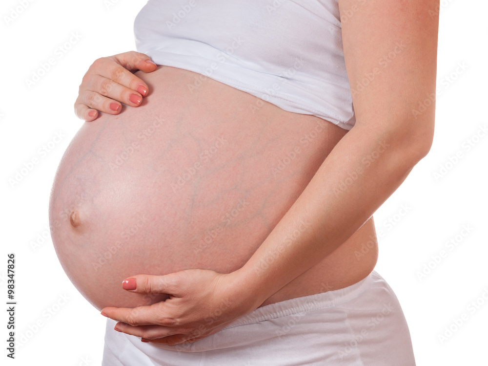 Pregnant Woman Belly. Pregnancy Concept. Isolated on a White Bac Pregnant Woman Belly. Pregnancy Concept. Isolated on a White Bac
