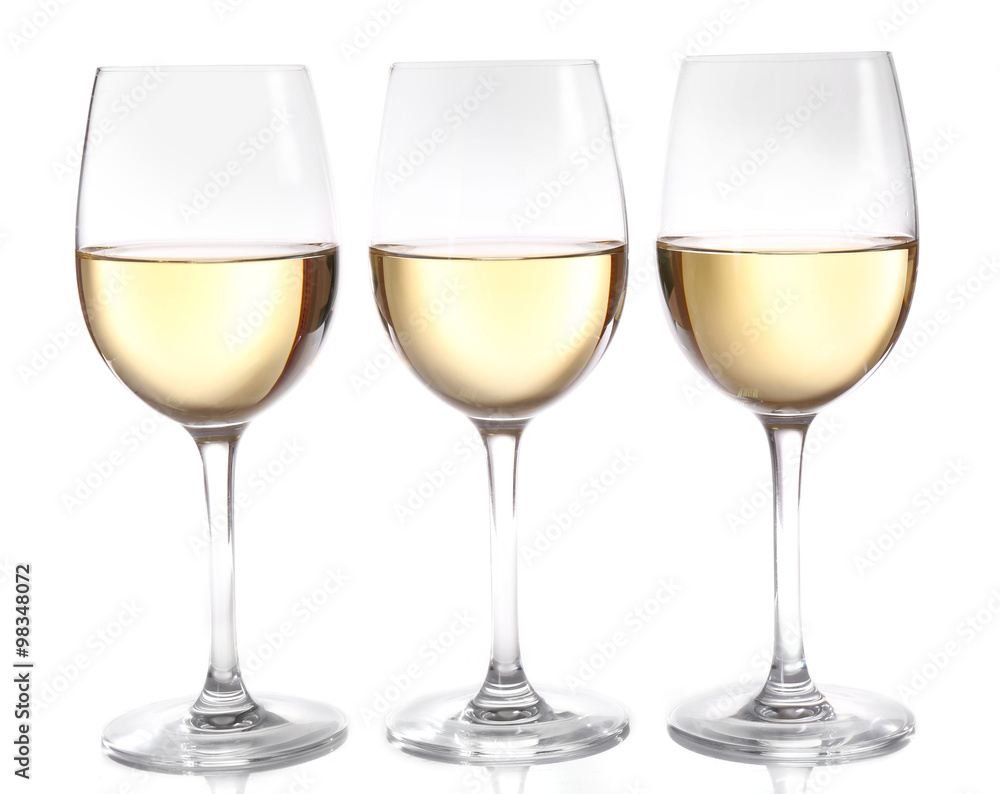 Three glasses of wine on light background