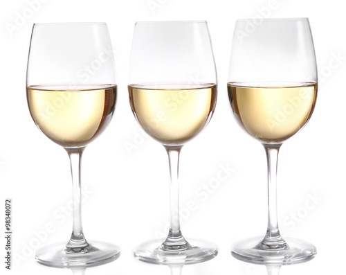 Three glasses of wine on light background