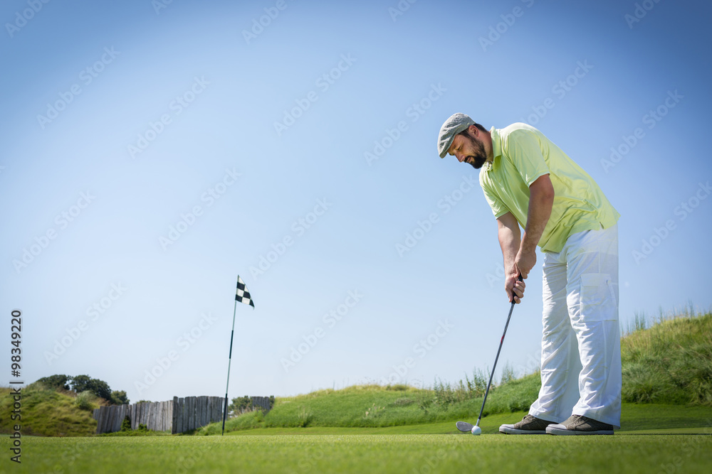 Fototapeta premium Man playing golf at club