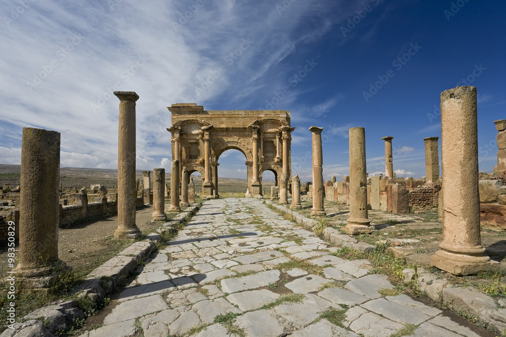 Algeria. Timgad (ancient Thamugadi or Thamugas). Decumanus street and surrounding colonnade terminated Trajan's Arch