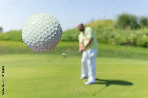 Man playing golf at club
