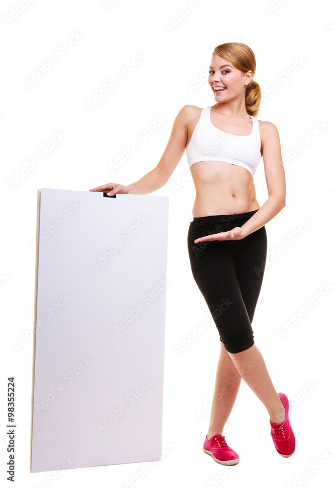 Fitness sporty woman holding blank empty ad banner Fitness sporty woman holding blank empty ad banner