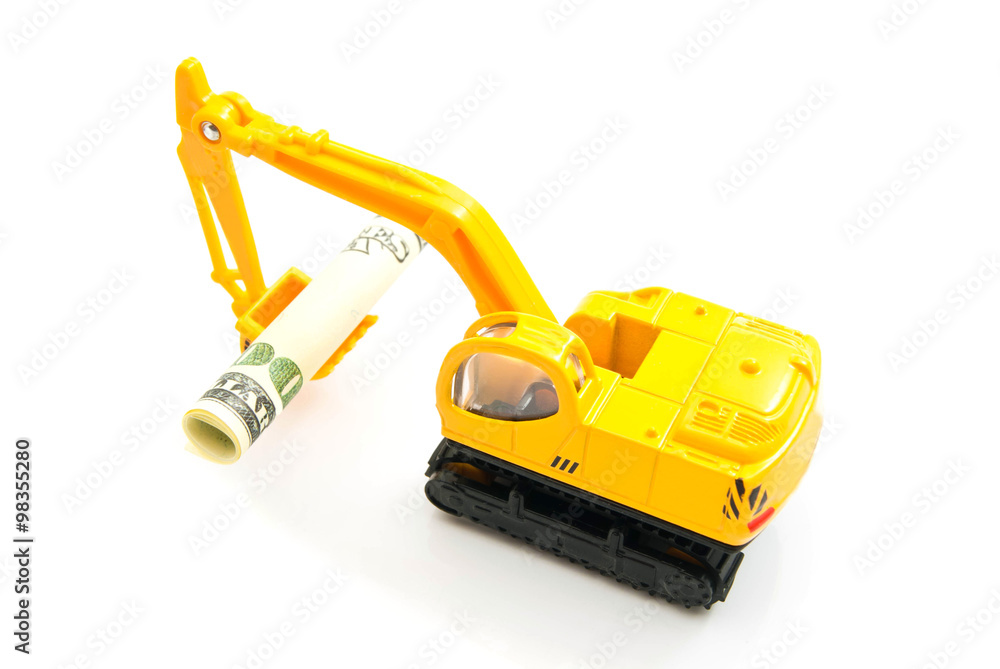 dollars banknotes and backhoe on white