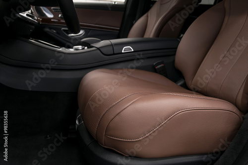 Prestige car interior background. Driver's leather seat.