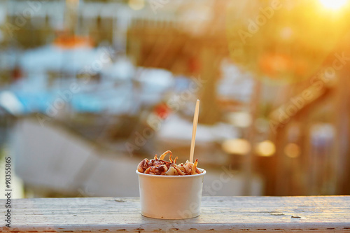 Canvas Print Traditional street food in San Francisco - shrimps and octopus