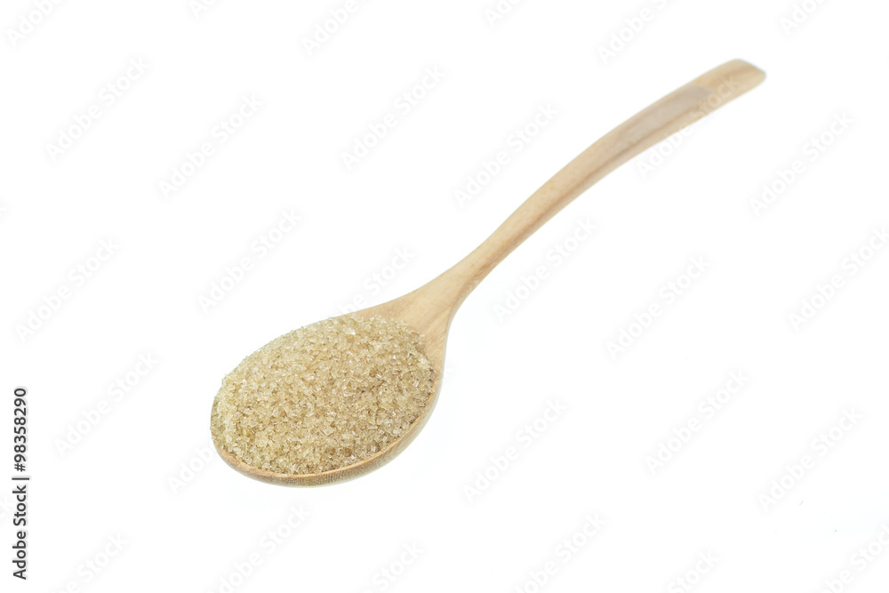 Close up of brown sugar in wooden spoon isolated on white Close up of brown sugar in wooden spoon isolated on white