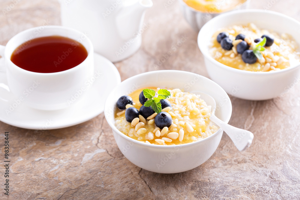 Cooked millet porridge with lemon curd and blueberry Cooked millet porridge with lemon curd and blueberry
