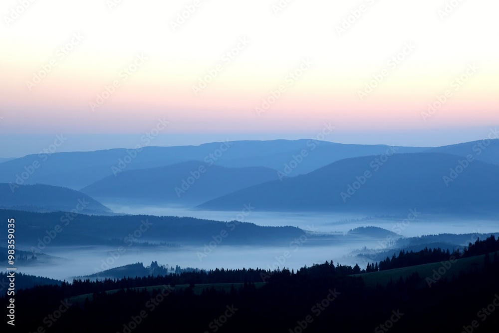 mountains in the mist before sun dawn