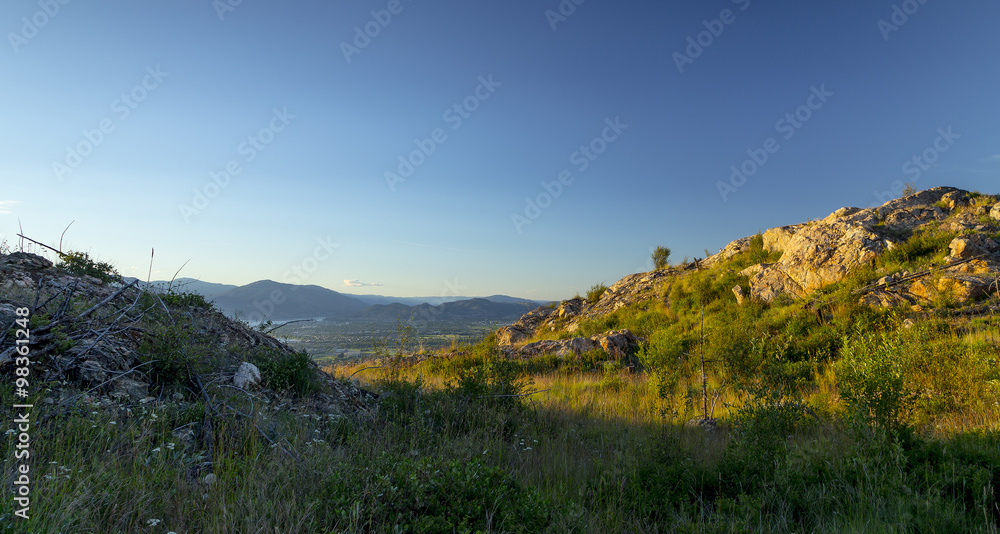 Scenic View of Kelowna and Okanagan Valley Landscape at Sunset
