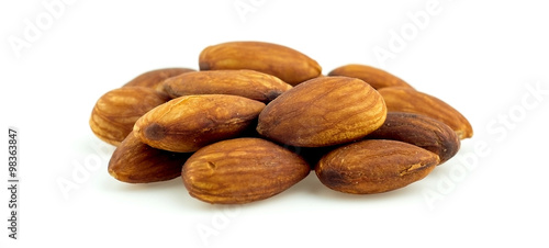 Macro of healthy raw shelled almonds isolated on white