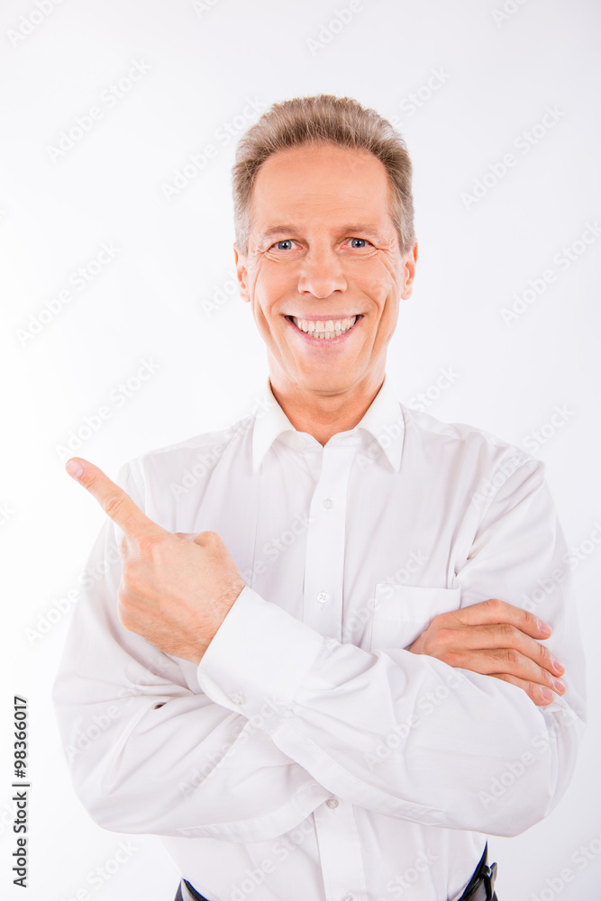 A senior man  in white shirt with beaming smile.
