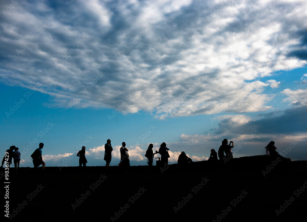 silhouettes of people admiring sunrise silhouettes of people admiring sunrise