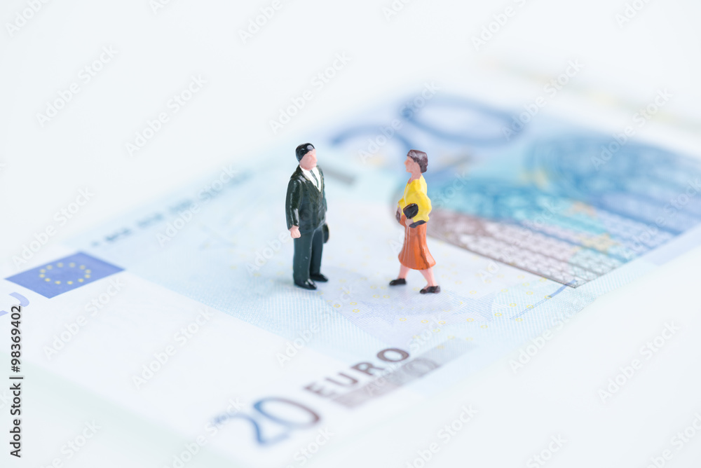 Miniature man and woman on Euro banknotes Miniature man and woman on Euro banknotes
