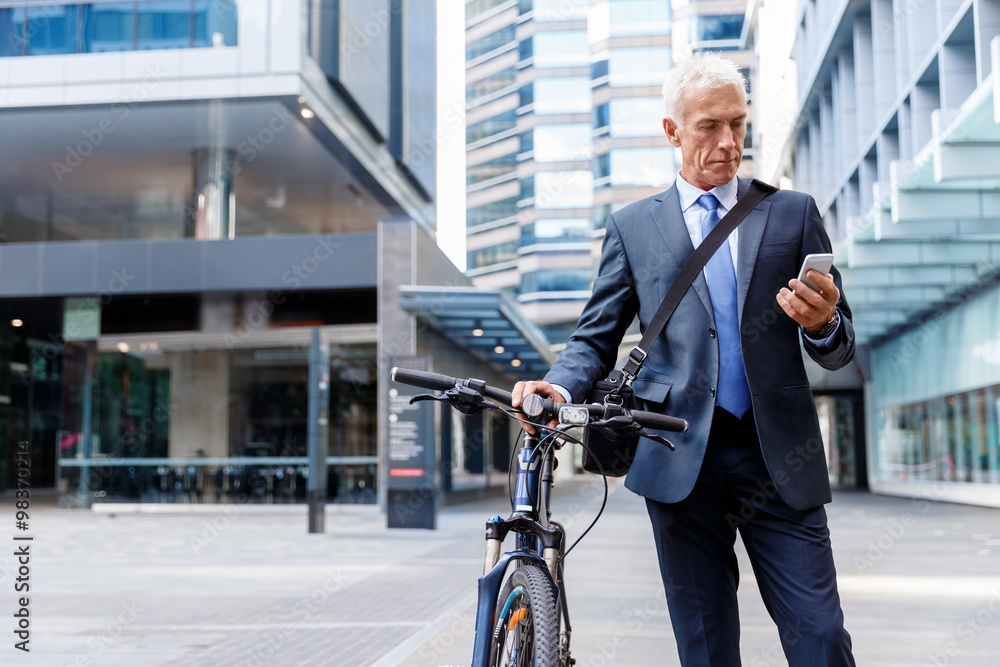 Successful businessman riding bicycle Successful businessman riding bicycle