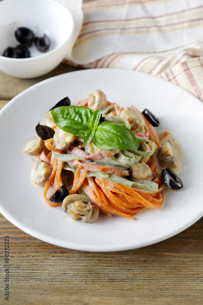 color pasta with mushrooms and olive