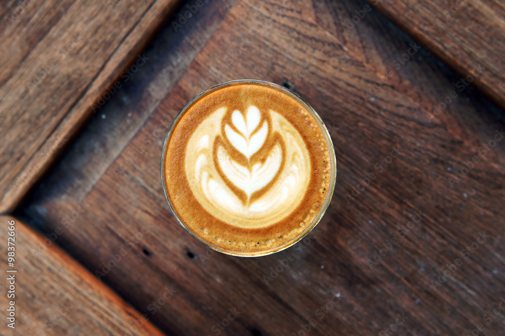 cup of latte art coffee on wooden background cup of latte art coffee on wooden background