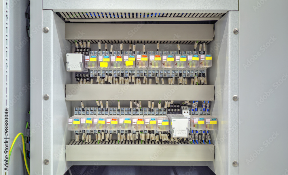Electrical control panel with relays and wires closeup