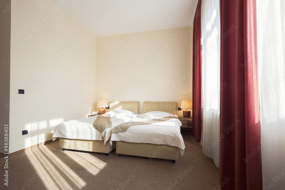 Hotel room interior with two beds