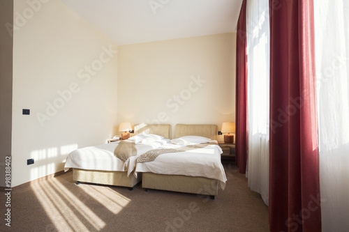 Hotel room interior with two beds