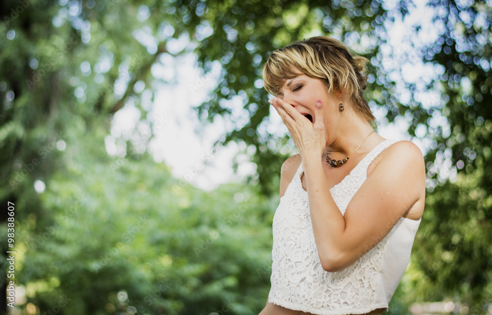 Bored or tired young woman yawning Bored or tired young woman yawning