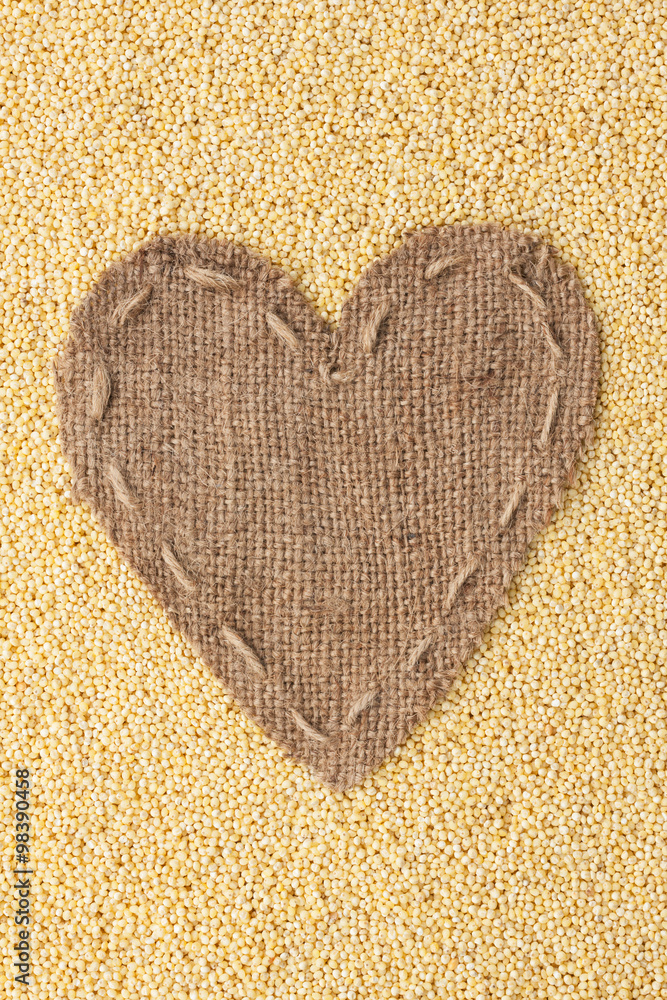 Frame in the shape of heart made of burlap with millet Frame in the shape of heart made of burlap with millet