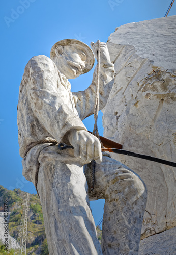 Statue to honor the work of the quarrymen of Carrara marble photo