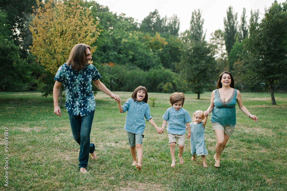 Happy young hipster family having fun while running, bowl, rising up, piggyback ride their children in park on summer sunset
Happy young hipster family having fun while running, bowl, rising up, piggyback ride their children in park on summer sunset