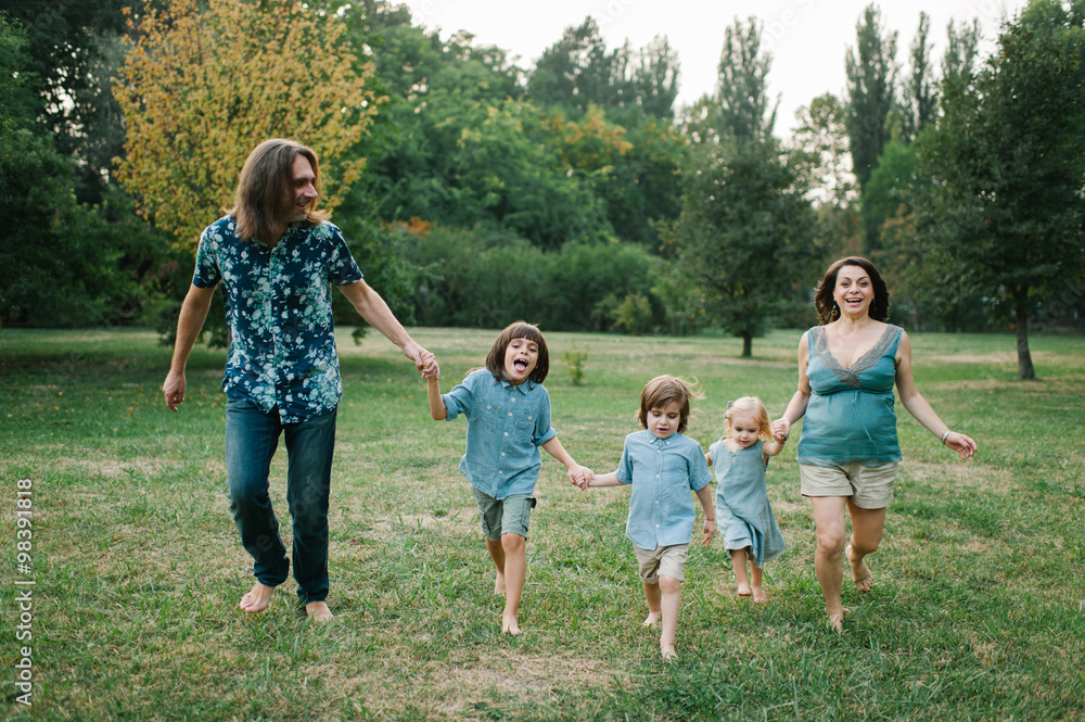 Happy young hipster family having fun while running, bowl, rising up, piggyback ride their children in park on summer sunset
Happy young hipster family having fun while running, bowl, rising up, piggyback ride their children in park on summer sunset