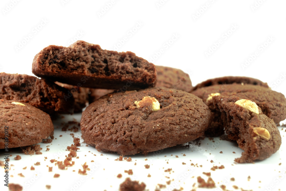 Dark chocolate cookies and white chocolate chip on white background Dark chocolate cookies and white chocolate chip on white background