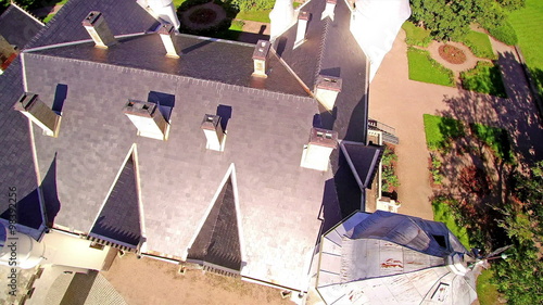Aerial shot of Alatskivi manor in Estonia. Alatskivi Manor combines three completely different cultures: the Scottish culture represented in the architecture of the manor house photo