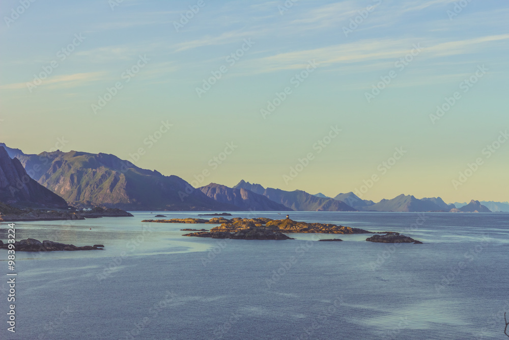 Breathtaking view from top of a mountain over islands in Norway at sunset 