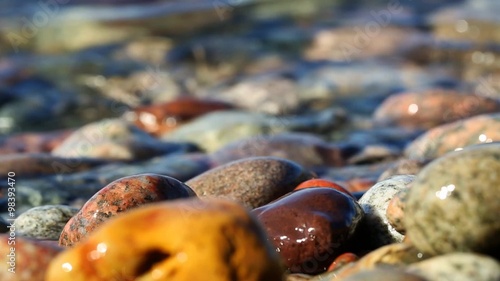 Lake Superior Stones on Beach - Waves ebb back and forth over colorful beach stones at Crisp Point in the Upper Peninsula of Michigan