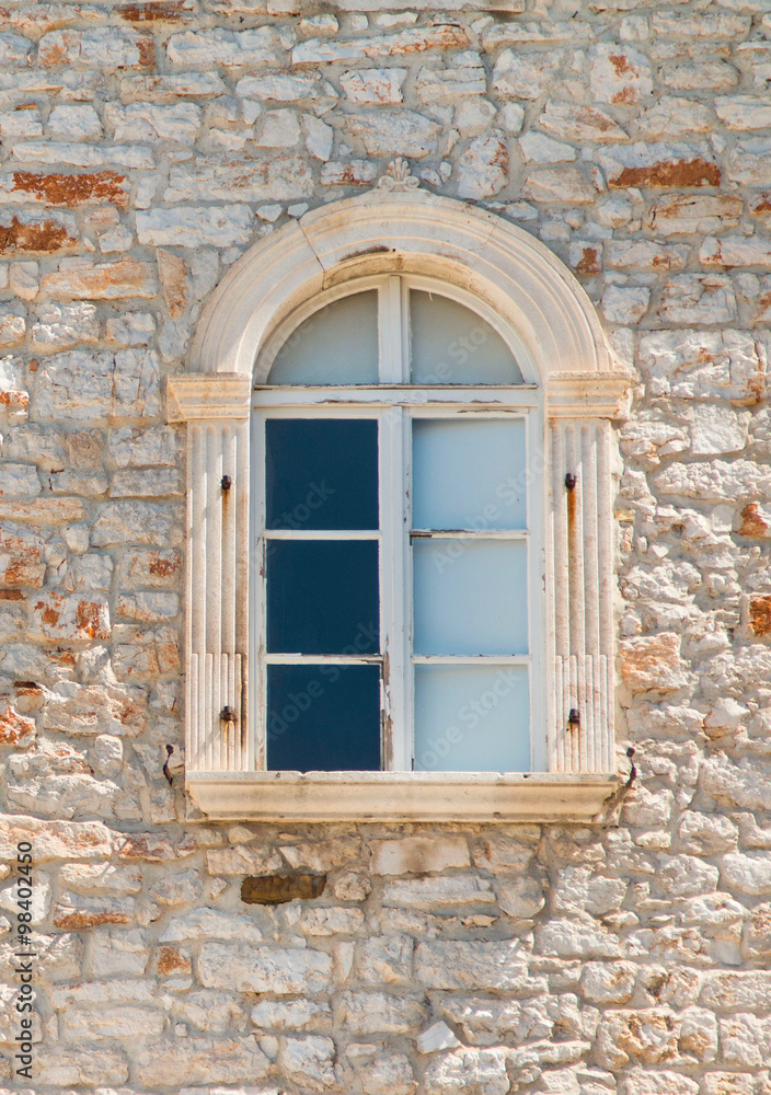 Windows on old traditional house in Sibenik, Croatia, facade details 