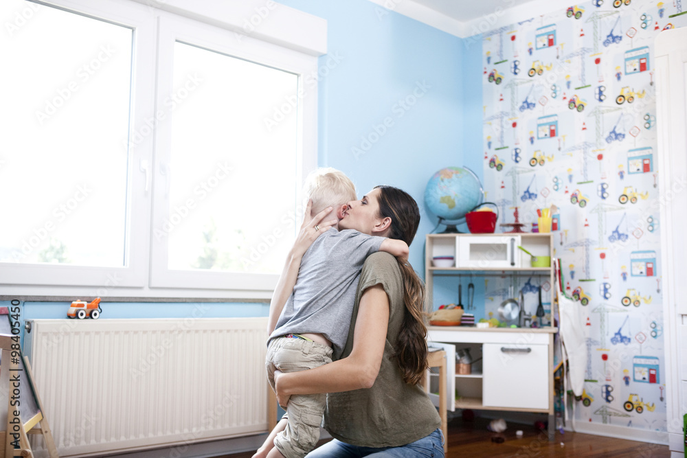 Mother and little son together at children's room Mother and little son together at children's room