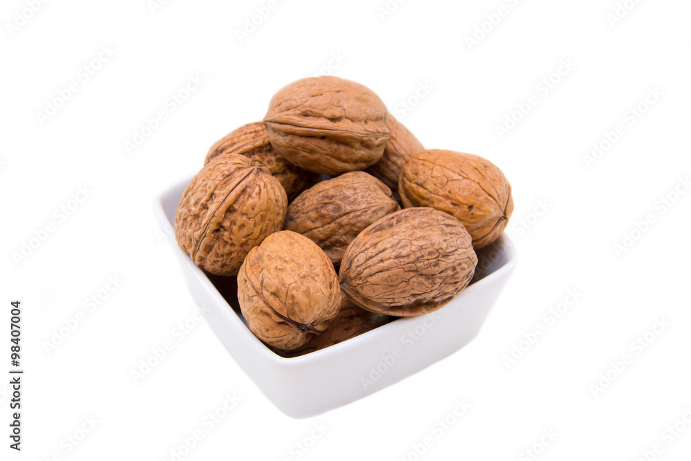 Square bowl of nuts on white background Square bowl of nuts on white background
