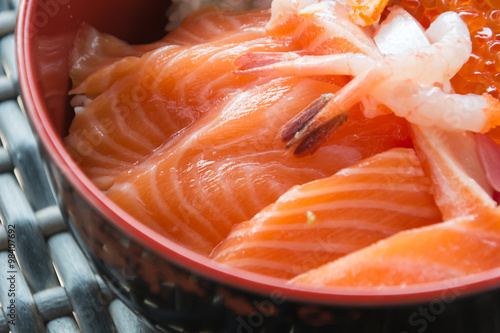 Rice with salmon sashimi on top