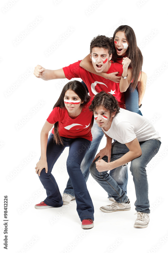 Group of football fans with their faces painted jumping - isolated over white Group of football fans with their faces painted jumping - isolated over white