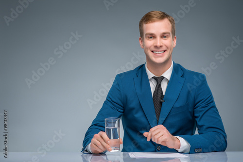 Принти на полотні Smiling newscaster during broadcasting.