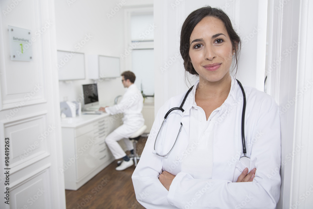 Portrait of smiling doctor at medical practice Portrait of smiling doctor at medical practice