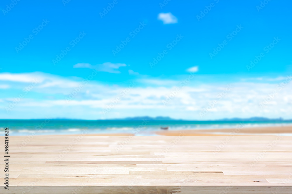 Fototapeta premium Wood table top on blur summer beach background