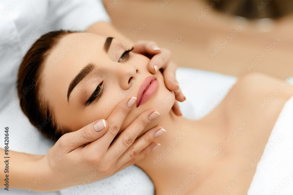 Skin, Body Care. Woman Getting Beauty Spa Face Massage. Treatmen Skin, Body Care. Woman Getting Beauty Spa Face Massage. Treatmen