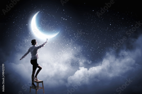 Woman touch the moon