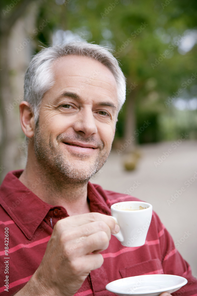Portrait of smiling man with cup of coffee Portrait of smiling man with cup of coffee