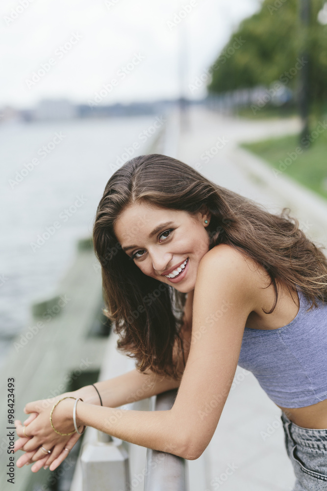 USA, New York City, smiling young woman at Hudson River USA, New York City, smiling young woman at Hudson River