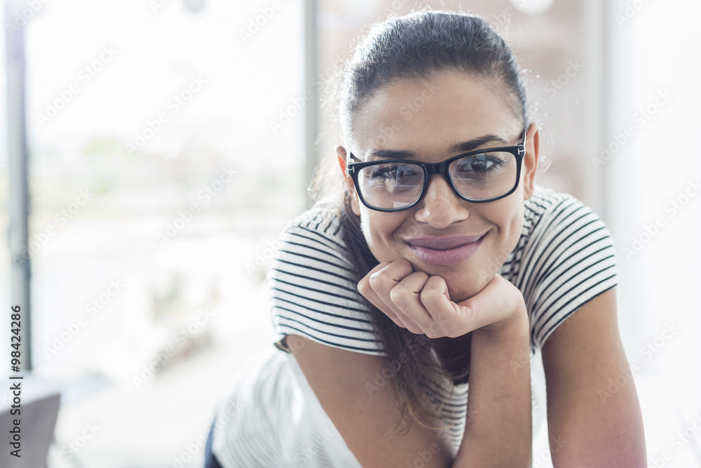 Portrait of smiling young woman wearing glasses Portrait of smiling young woman wearing glasses